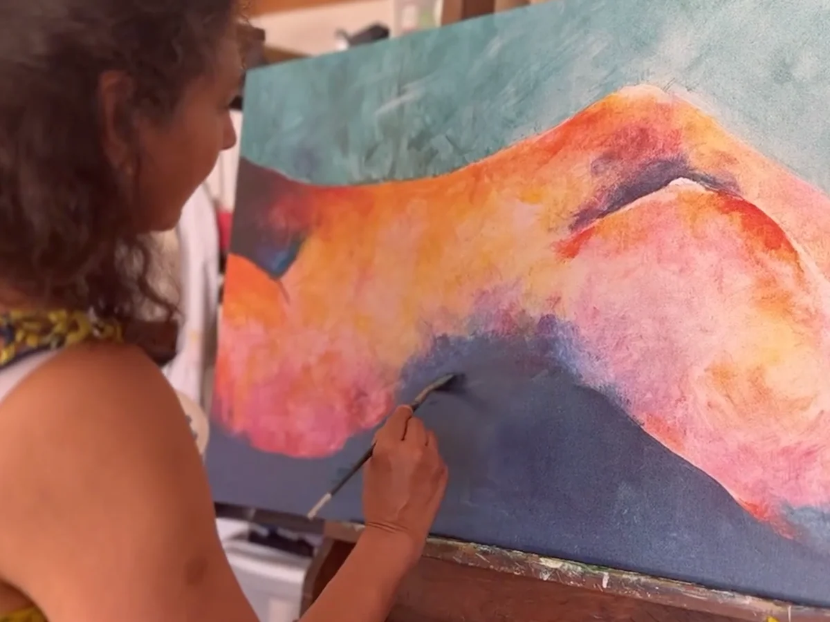 Suchi in the studio working on canvas